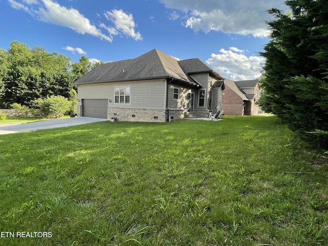 103 Crossroads Blvd, Oak Ridge, TN 37830 - view of home's exterior featuring concrete driveway, a yard, an attached garage, and crawl space