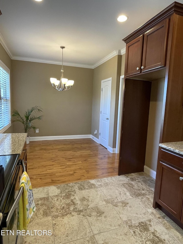 103 Crossroads Blvd, Oak Ridge, TN 37830 - kitchen with crown molding, a chandelier, baseboards, hanging light fixtures, and light wood-style floors
