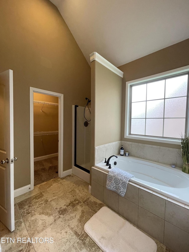 103 Crossroads Blvd, Oak Ridge, TN 37830 - full bathroom featuring a stall shower, a bath, a spacious closet, and high vaulted ceiling