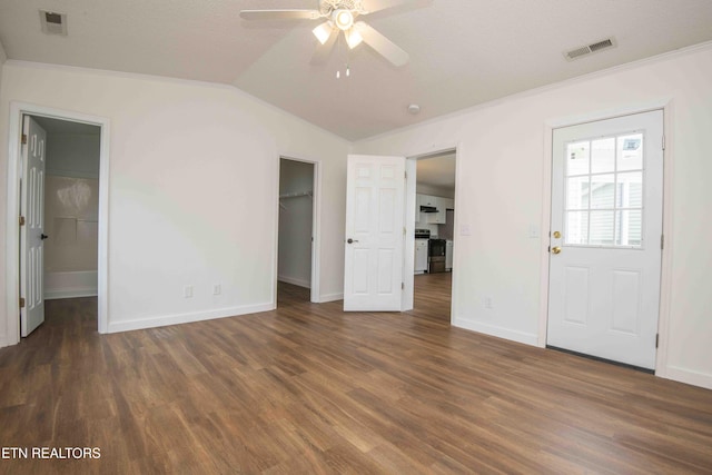 1713 Sails Way, Knoxville, TN 37932 - unfurnished bedroom with wood finished floors, vaulted ceiling, ornamental molding, a walk in closet, and baseboards