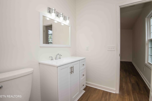 1713 Sails Way, Knoxville, TN 37932 - bathroom with wood finished floors, vanity, toilet, baseboards, and healthy amount of natural light