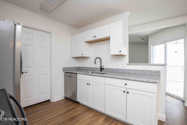 1713 Sails Way, Knoxville, TN 37932 - kitchen with stainless steel appliances, a sink, dark wood finished floors, white cabinetry, and crown molding