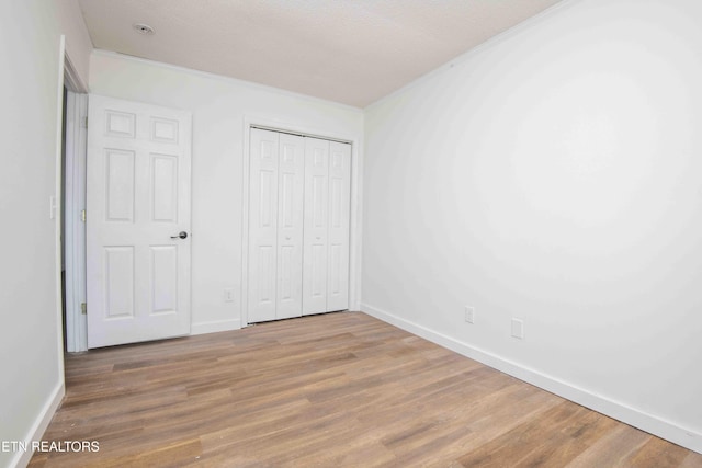 1713 Sails Way, Knoxville, TN 37932 - unfurnished bedroom with wood finished floors, baseboards, and a closet