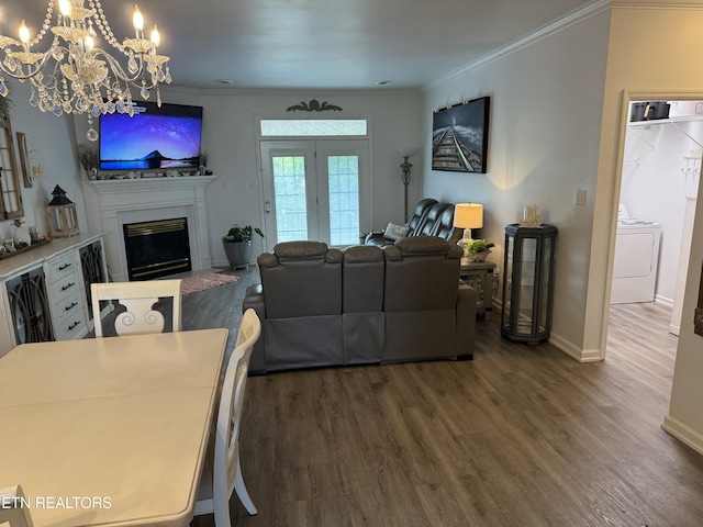 740 Sterchi Park Way Unit F7, Knoxville, TN 37912 - living room with washer / clothes dryer, wood finished floors, a chandelier, a glass covered fireplace, and baseboards