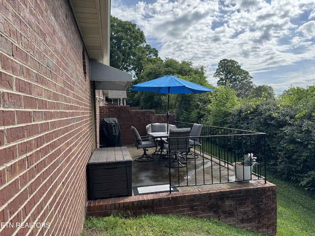 740 Sterchi Park Way Unit F7, Knoxville, TN 37912 - wooden terrace with area for grilling, outdoor dining area, and a patio