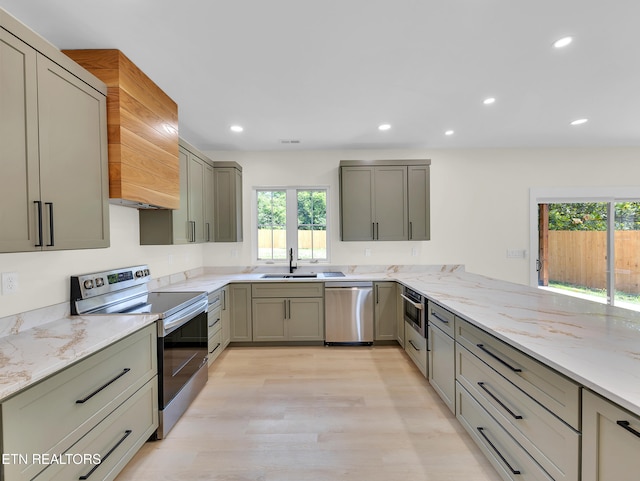 7747 Drawbridge Ct, Powell, TN 37849 - kitchen with stainless steel appliances, a sink, healthy amount of natural light, light stone counters, and recessed lighting