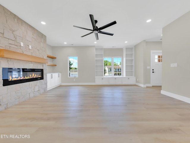 7747 Drawbridge Ct, Powell, TN 37849 - unfurnished living room with light wood-style floors, baseboards, a fireplace, built in features, and recessed lighting