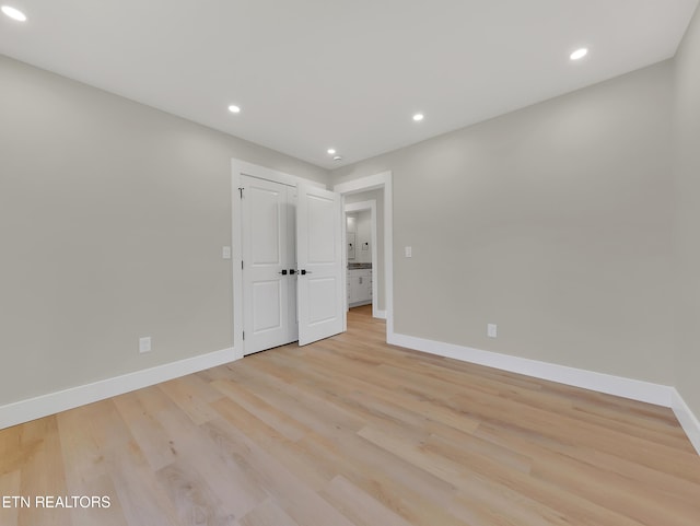 7747 Drawbridge Ct, Powell, TN 37849 - unfurnished bedroom featuring baseboards, light wood-style floors, and recessed lighting