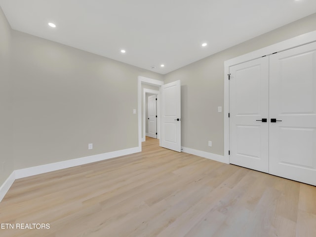 7747 Drawbridge Ct, Powell, TN 37849 - unfurnished bedroom with light wood-type flooring, baseboards, recessed lighting, and a closet