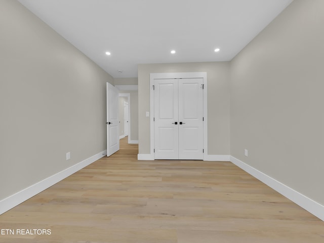 7747 Drawbridge Ct, Powell, TN 37849 - unfurnished bedroom with baseboards, light wood finished floors, recessed lighting, and a closet