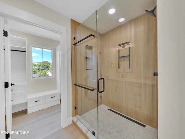 7747 Drawbridge Ct, Powell, TN 37849 - bathroom featuring a shower stall and wood finished floors