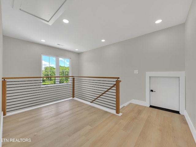 7747 Drawbridge Ct, Powell, TN 37849 - empty room featuring wood finished floors, attic access, baseboards, and recessed lighting