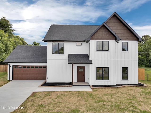 7747 Drawbridge Ct, Powell, TN 37849 - modern farmhouse with roof with shingles, an attached garage, and driveway