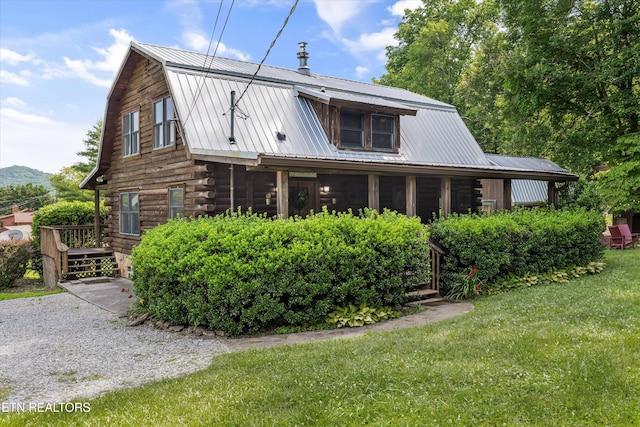 3509 Ginseng Way, Sevierville, TN 37862 - view of front facade with log siding, a gambrel roof, metal roof, and a front yard