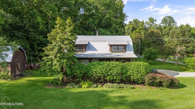 3509 Ginseng Way, Sevierville, TN 37862 - view of front facade with a front yard and metal roof