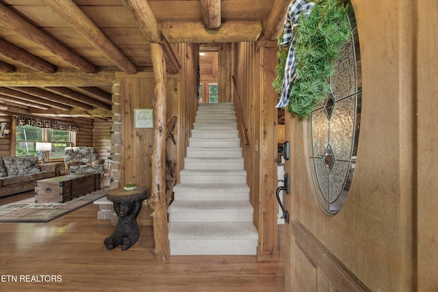 3509 Ginseng Way, Sevierville, TN 37862 - staircase with wood finished floors, wood ceiling with exposed beams, and rustic walls