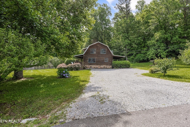 3509 Ginseng Way, Sevierville, TN 37862 - cabin featuring driveway, a front lawn, and log siding