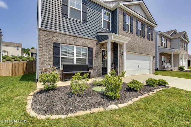 12017 Spearmint Ln, Knoxville, TN 37932 - view of front of property with brick siding, driveway, and a garage