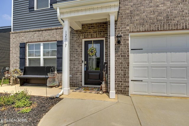 12017 Spearmint Ln, Knoxville, TN 37932 - view of exterior entry featuring brick siding and driveway