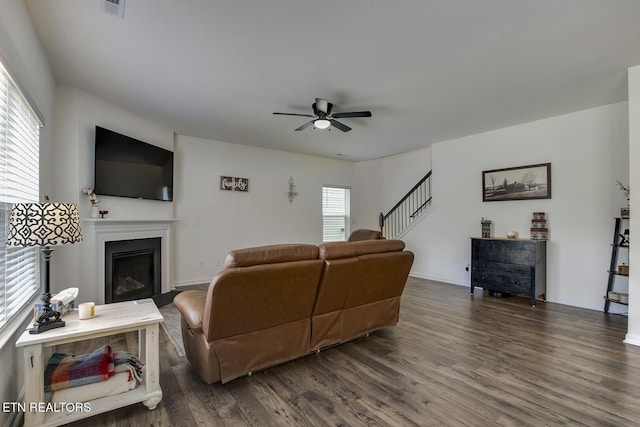 12017 Spearmint Ln, Knoxville, TN 37932 - living room with ceiling fan, dark wood-type flooring, a fireplace, stairs, and baseboards
