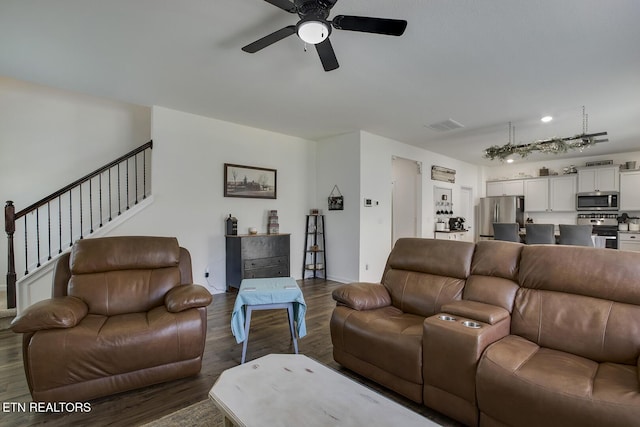 12017 Spearmint Ln, Knoxville, TN 37932 - living room with dark wood-style flooring, ceiling fan, stairway, and baseboards