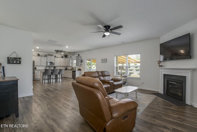 12017 Spearmint Ln, Knoxville, TN 37932 - living area featuring ceiling fan, dark wood-style floors, a fireplace with flush hearth, baseboards, and recessed lighting