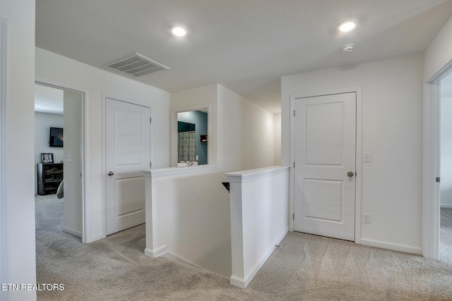 12017 Spearmint Ln, Knoxville, TN 37932 - hallway featuring light colored carpet, baseboards, an upstairs landing, and recessed lighting