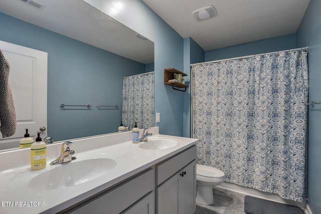 12017 Spearmint Ln, Knoxville, TN 37932 - bathroom featuring toilet, double vanity, and a shower with shower curtain