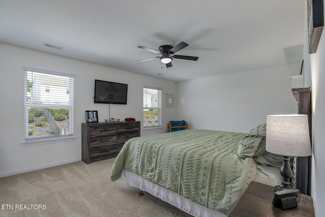 12017 Spearmint Ln, Knoxville, TN 37932 - bedroom with baseboards, light colored carpet, and a ceiling fan