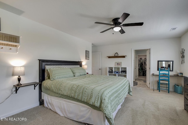 12017 Spearmint Ln, Knoxville, TN 37932 - bedroom featuring light carpet, a spacious closet, a ceiling fan, and baseboards
