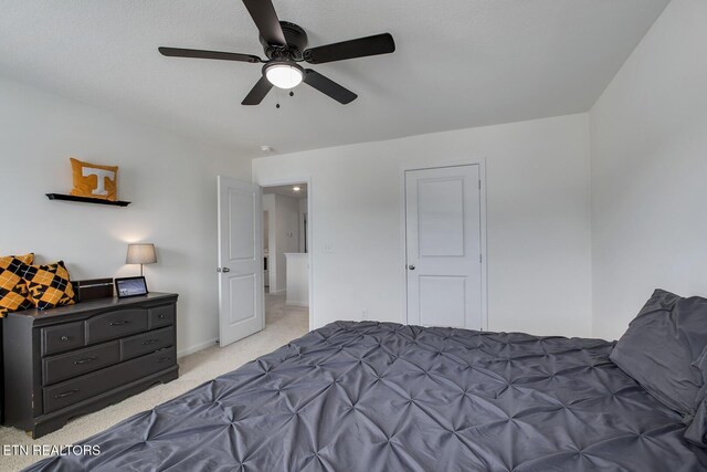 12017 Spearmint Ln, Knoxville, TN 37932 - bedroom with light carpet, baseboards, and a ceiling fan