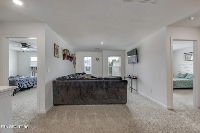 12017 Spearmint Ln, Knoxville, TN 37932 - living area featuring light carpet, baseboards, and ceiling fan