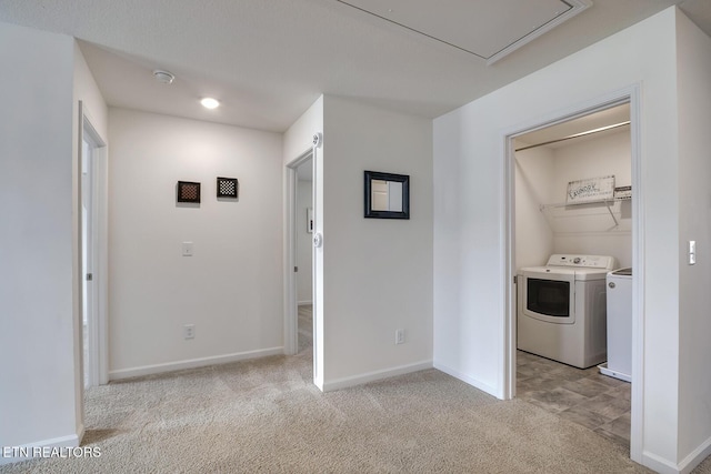 12017 Spearmint Ln, Knoxville, TN 37932 - hall featuring washer and dryer, light carpet, baseboards, and attic access