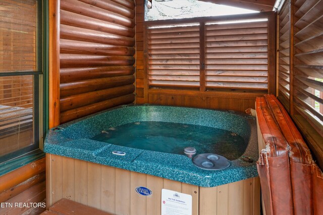 2405 Autumn Valley Way, Pigeon Forge, TN 37862 - detailed view of log veneer siding and a jacuzzi