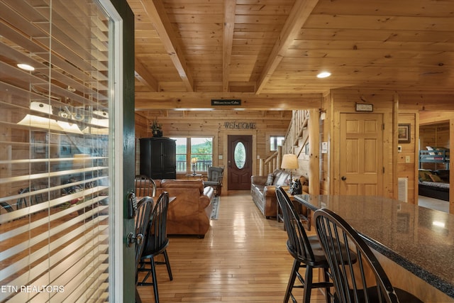 2405 Autumn Valley Way, Pigeon Forge, TN 37862 - dining area featuring wood ceiling with exposed beams, light wood finished floors, and wood walls