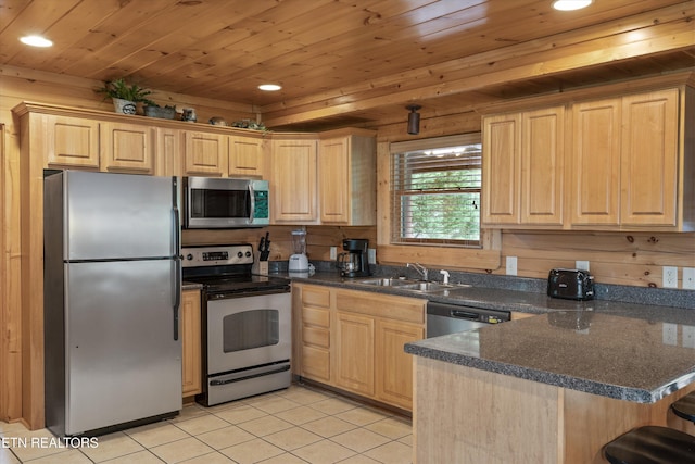 2405 Autumn Valley Way, Pigeon Forge, TN 37862 - kitchen featuring stainless steel appliances, a sink, light brown cabinetry, recessed lighting, and a peninsula