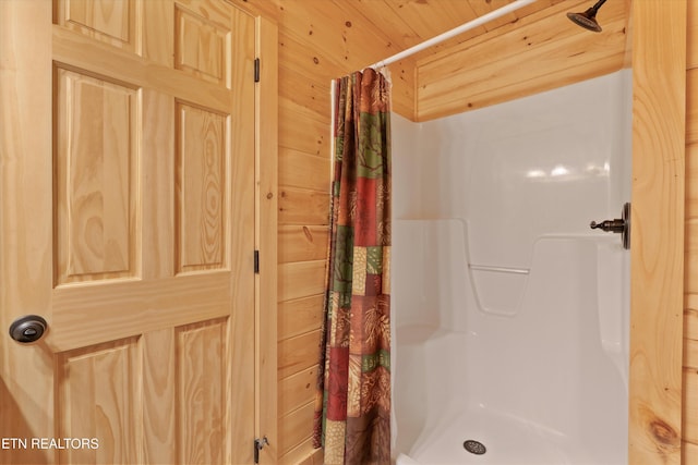 2377 Alpine Village Way, Pigeon Forge, TN 37862 - bathroom featuring curtained shower and wooden walls