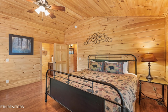 2377 Alpine Village Way, Pigeon Forge, TN 37862 - bedroom featuring wooden ceiling, wood walls, wood finished floors, and connected bathroom