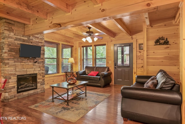 2377 Alpine Village Way, Pigeon Forge, TN 37862 - living area with wooden ceiling with exposed beams, healthy amount of natural light, wood walls, wood finished floors, and a ceiling fan