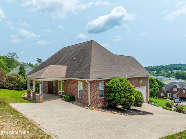 128 Harbour View Way, Kingston, TN 37763 - view of front of property featuring brick siding, concrete driveway, roof with shingles, and a front yard