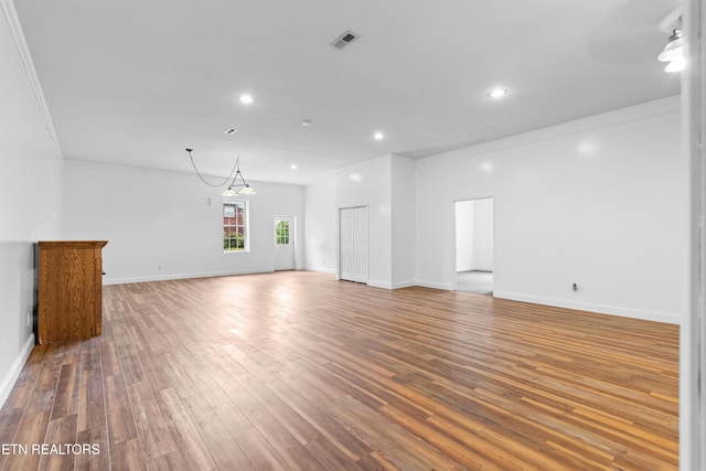 128 Harbour View Way, Kingston, TN 37763 - unfurnished living room featuring crown molding, wood finished floors, recessed lighting, baseboards, and a chandelier