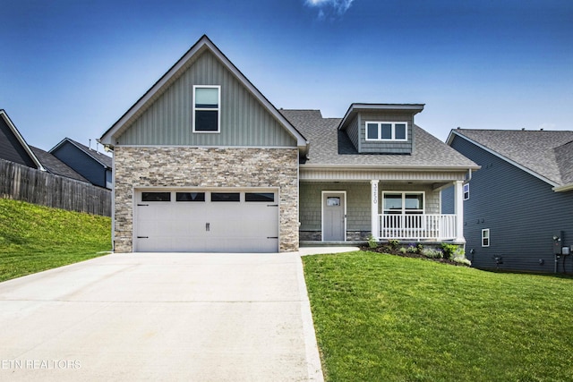 3250 Truitt Path Ln, Knoxville, TN 37931 - craftsman-style home with board and batten siding, a porch, driveway, and stone siding