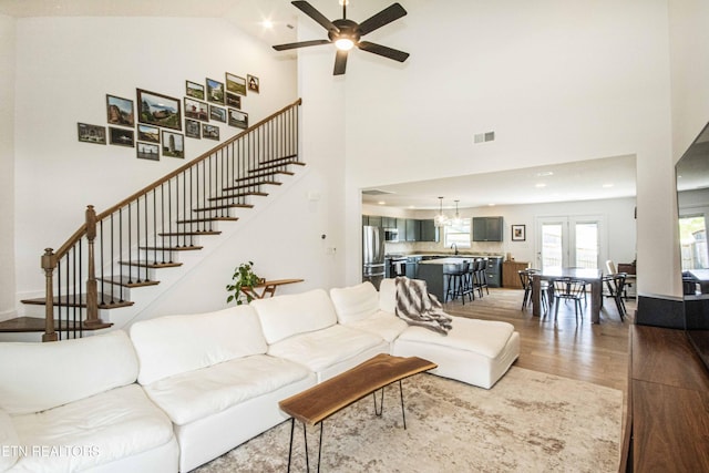 3250 Truitt Path Ln, Knoxville, TN 37931 - living area featuring wood finished floors, stairs, a ceiling fan, high vaulted ceiling, and recessed lighting