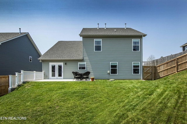 3250 Truitt Path Ln, Knoxville, TN 37931 - back of property with a patio and a shingled roof