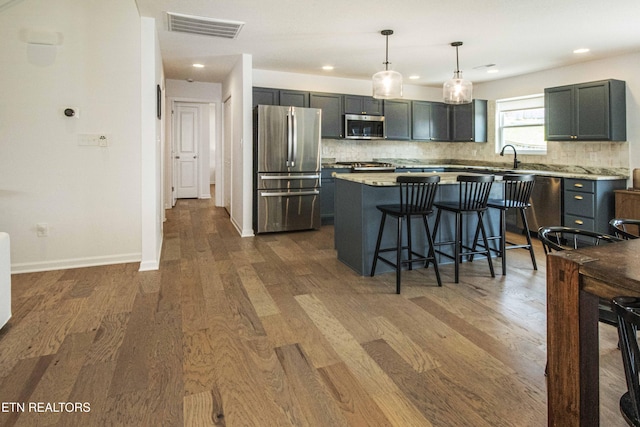 3250 Truitt Path Ln, Knoxville, TN 37931 - kitchen featuring appliances with stainless steel finishes, dark wood finished floors, tasteful backsplash, light countertops, and recessed lighting