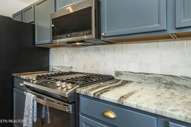 3250 Truitt Path Ln, Knoxville, TN 37931 - kitchen featuring appliances with stainless steel finishes, backsplash, and blue cabinetry