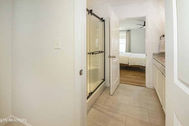 3250 Truitt Path Ln, Knoxville, TN 37931 - ensuite bathroom with a stall shower, vanity, tile patterned flooring, and baseboards