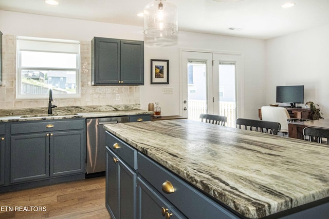 3250 Truitt Path Ln, Knoxville, TN 37931 - kitchen featuring stainless steel dishwasher, a sink, backsplash, light stone countertops, and recessed lighting