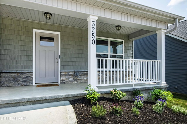 3250 Truitt Path Ln, Knoxville, TN 37931 - view of exterior entry featuring covered porch and stone siding