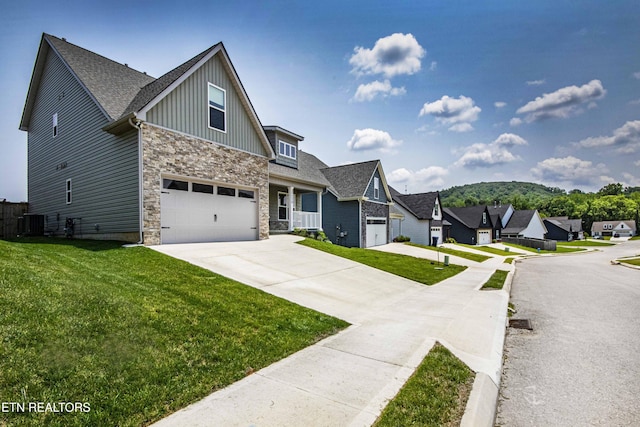3250 Truitt Path Ln, Knoxville, TN 37931 - craftsman-style house with board and batten siding, concrete driveway, stone siding, and a front yard